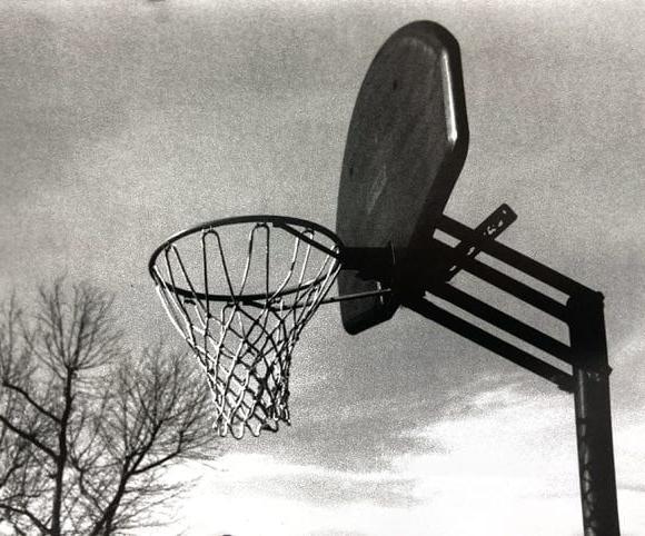 black and white photograph basketball net
